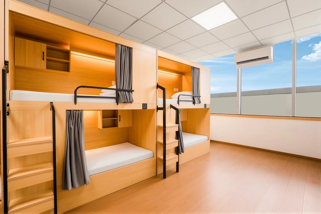 Jushe Hostel bunk with privacy curtain, reading light, sockets and storage